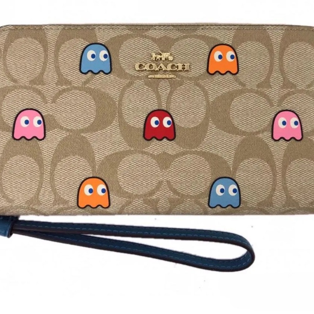 COACH PHONE WALLET WITH PAC-MAN
GHOSTS PRINT